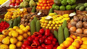 Exotic tropical fruits on the market. Edible bright fruity summer background. Fruit growing, gardening and agriculture. Panoramic movement - Powered by Shutterstock - Get 15% off with code: PIKWIZARD15