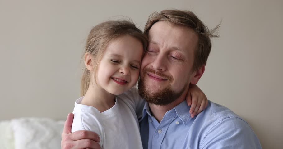 Close up portrait loving father and little cute daughter touch faces with eyes closed enjoy moment of tenderness, feeling unconditional love and bond, spend priceless time together. Happy fatherhood Royalty-Free Stock Footage #1098725777