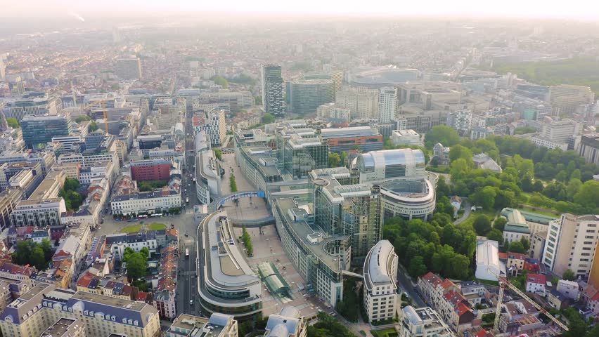 Inscription on video. Brussels, Belgium. The complex of buildings of the European Parliament. State institution. Knitted texture inscription, Aerial View, Point of interest