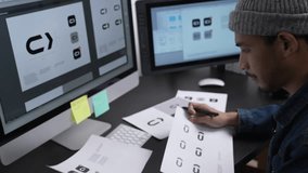 Graphic designer drawing sketches logo design. The concept of a new brand. Professional creative occupation with idea. - Powered by Shutterstock - Get 15% off with code: PIKWIZARD15