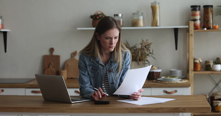 Young woman counting expenses, prepare financial report working at home feeling stressed and angry due to mistake in statement. Financial difficulties, bankruptcy, lack of money to pay monthly bills Royalty-Free Stock Footage #1098732615