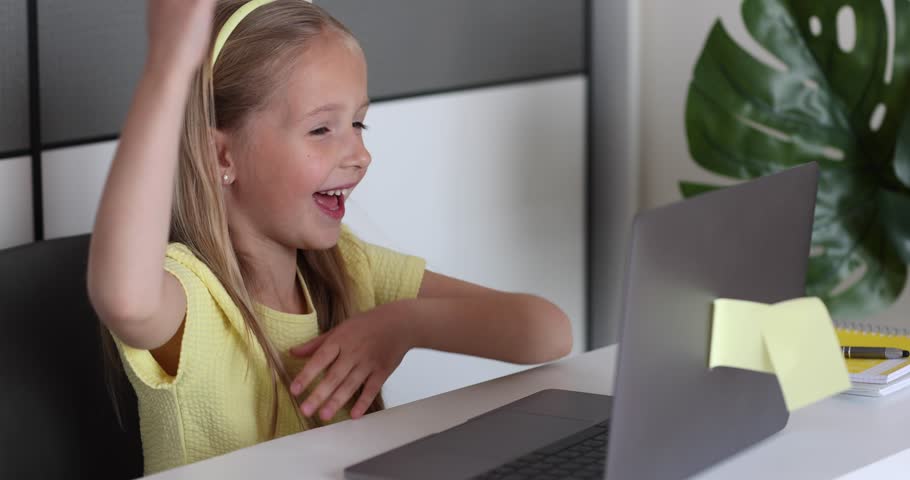 Caucasian little girl school pupil studying online from home, watching web class lesson or listening tutor by video call elearning during coronavirus covid-19 pandemic self isolation. Slow motion | Shutterstock HD Video #1098733513