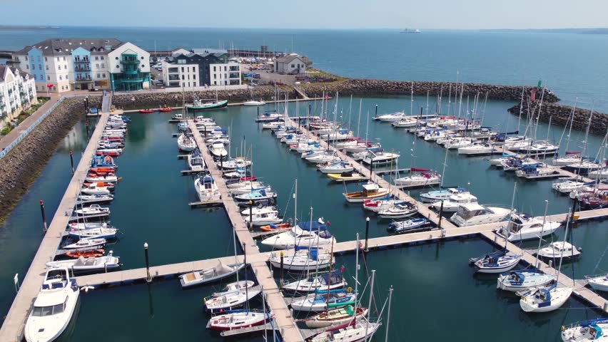 Aerial video of boats and yachts in Carrickfergus Marina Co Antrim Northern Ireland 