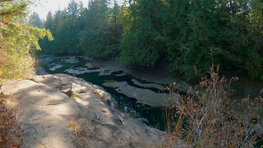 Cinematic View of Canadian Nature during sunny fall summer day. Oyster River Potholes, in Campbell River, Vancouver Island, British Columbia, Canada.