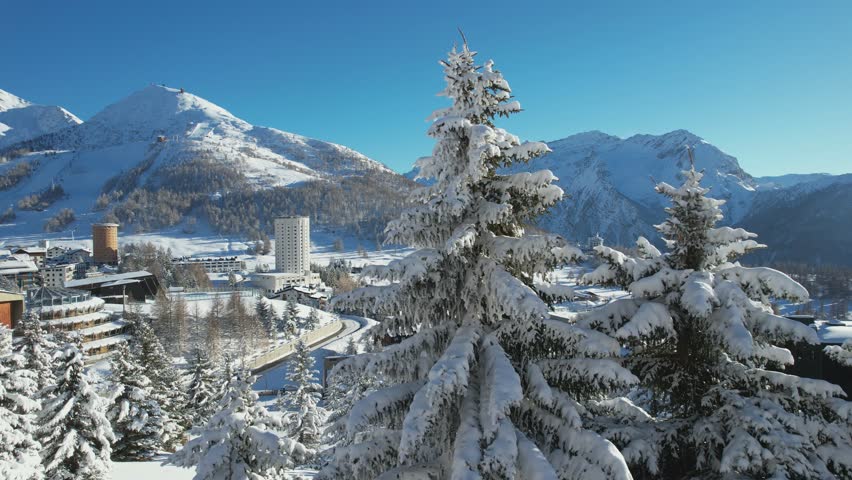 Overview of the snow-covered alpine village of Sestriere, which was the site of the Winter Olympics in 2006. Sestriere, Piedmont, Italy