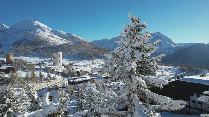 Overview of the snow-covered alpine village of Sestriere, which was the site of the Winter Olympics in 2006. Sestriere, Piedmont, Italy