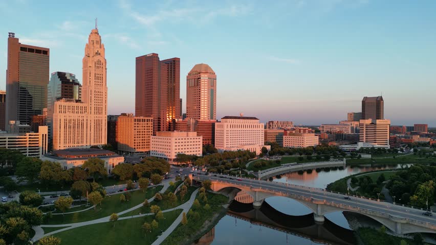 Aerial golden hour city skyline pan with traffic - Columbus, Ohio