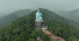 Aerial View at Morning Wat Phra That Doi Phra Chan. and Daibutsu Buddha on the mountain at Lampang Province Thailand 4k video from Drone.