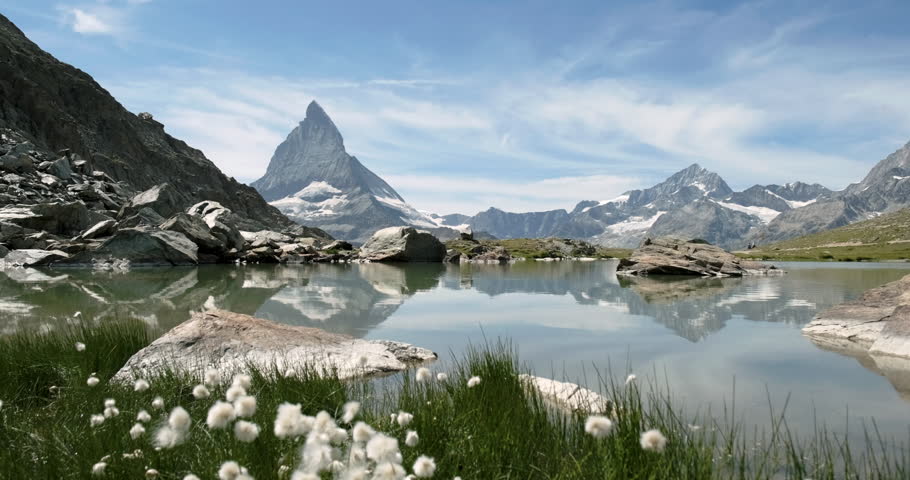 Drone landing on Riffelsee Lake with Matterhorn in the background Royalty-Free Stock Footage #1098763711