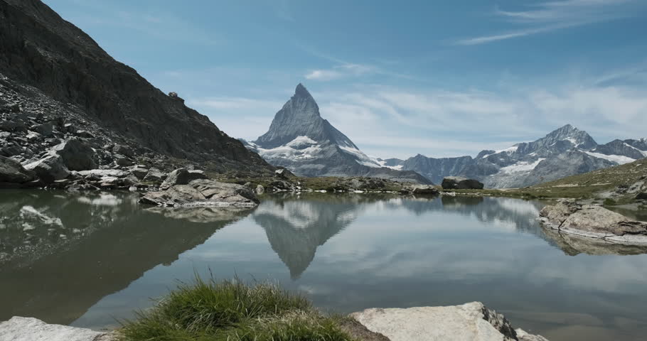 Timelapse of Matterhorn reflected in Riffelsee Lake Royalty-Free Stock Footage #1098763717