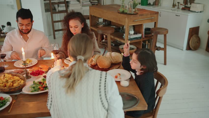 Confident multicultural family celebrating Christmas and talking at home | Shutterstock HD Video #1098764685