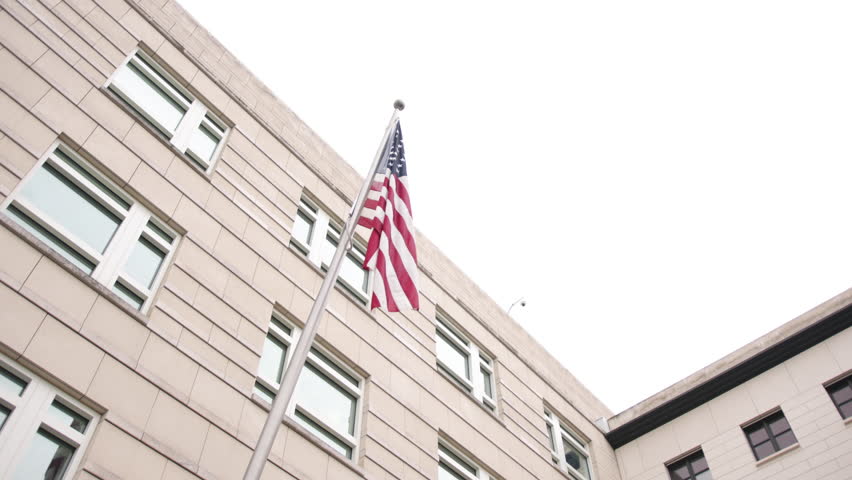 Flag of the United States of America on flagpole of American Embassy in Berlin, Germany, on Memorial Day, Veteran