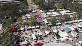 4K Aerial Drone Video (Stationary High Angle) of Shoppers at Farmers Market in Downtown St. Petersburg, FL
