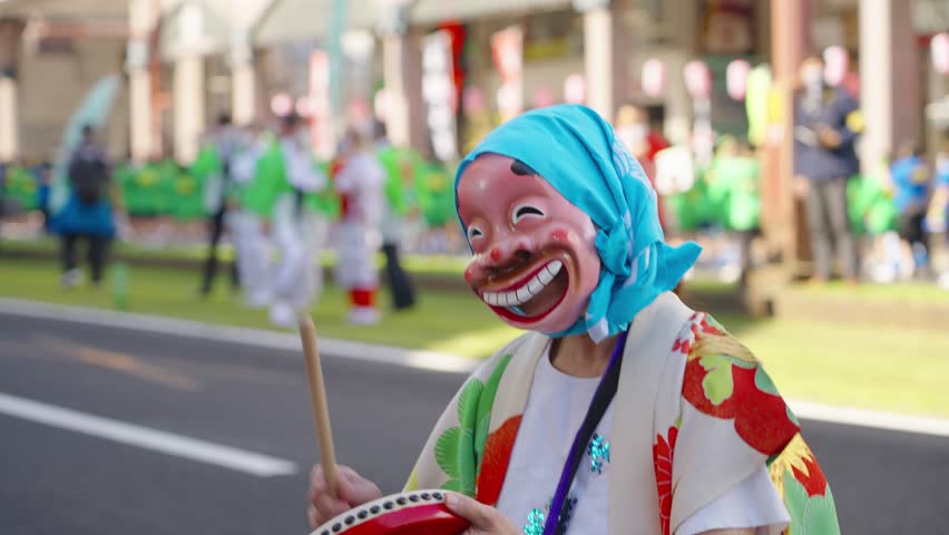 Funny masked Japanese dancer at Ohara Festival in Kagoshima; shallow focus | Shutterstock HD Video #1098777655