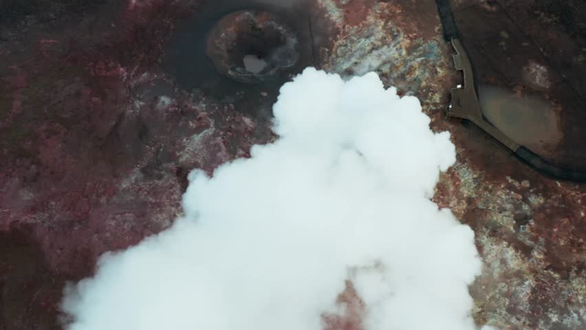Active volcano emitting steam at Gunnuhver Hot Springs in Iceland, aerial