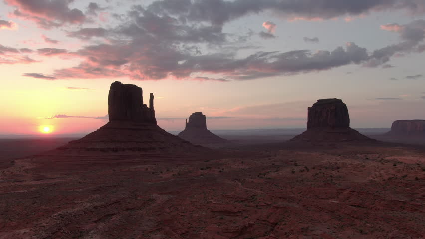 Monument Valley Sunrise Over Buttes Aerial Shot Rotate R Navajo Nation Southwest Desert Arizona Utah USA Royalty-Free Stock Footage #1098789421