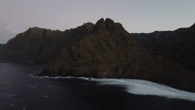 drone video over sea with waves and mountains