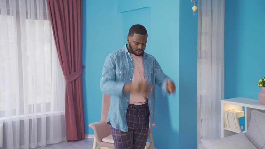 Disappointed African man. Stressful and tense.
Frustrated African man at home. He has a problem.
