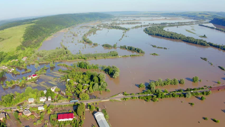 4k drone flight moving to the side footage (Ultra High Definition) of flooded villages in western Ukraine. Flood on the Dniester River, Nyzhniv village after few days of huge rain. Royalty-Free Stock Footage #1098799855