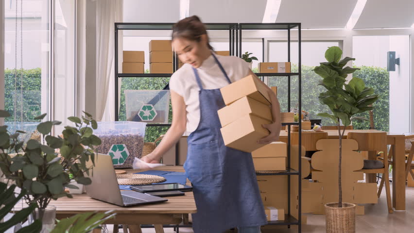 Time lapse asia ecommerce home office of Net zero waste Go green vendor online shop small store. Smart seller SME owner young woman asian people busy packing order work in eco friendly packaging box. | Shutterstock HD Video #1098800899