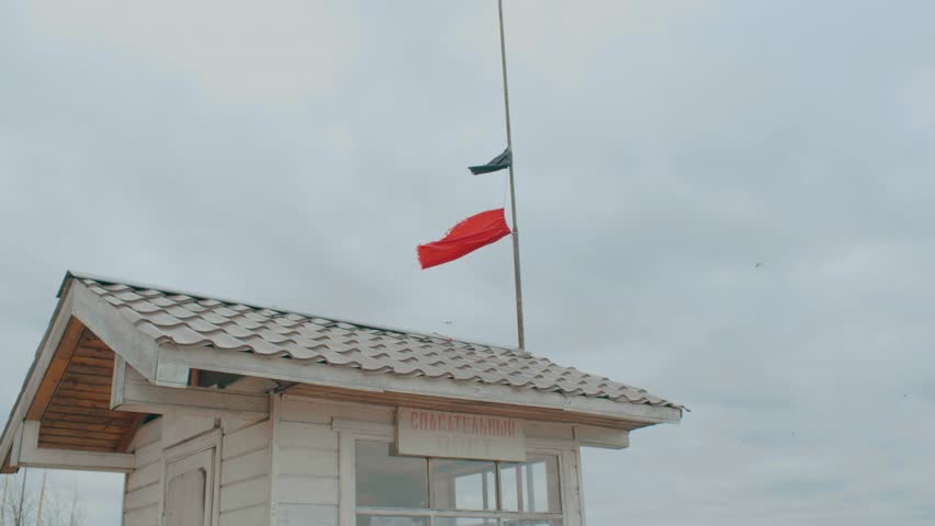 Flags on the roof and waves