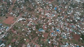 Kisesa, Mwanza, Tanzania aerial video showing houses and buildings in the rural village close to a big lake Victoria