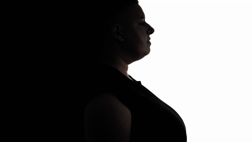 Enjoying pregnancy. Obese woman. Silhouette portrait. Female profile of plus size model feeling satisfied contouring body on black white background copy space. Royalty-Free Stock Footage #1098810877