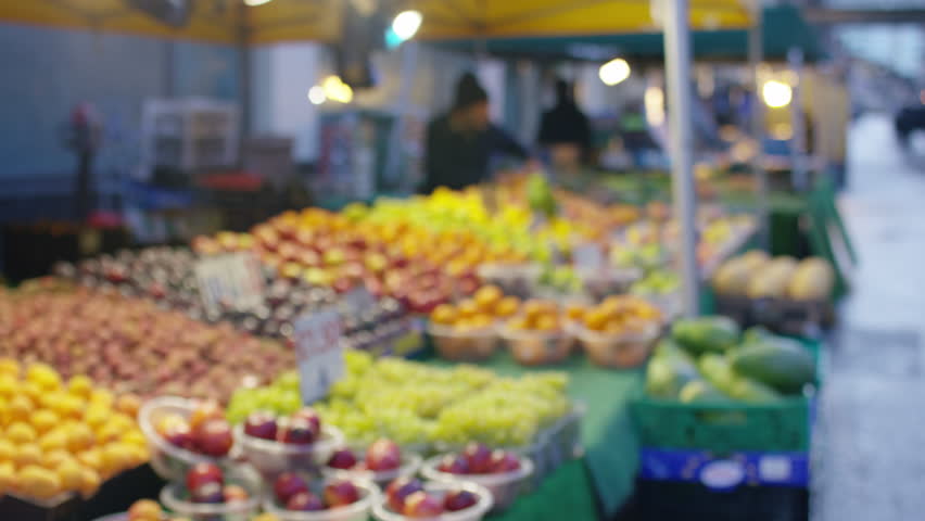 Blurred background of fruit market seller setting up his stall early in the morning before customers arrive | Shutterstock HD Video #1098813151