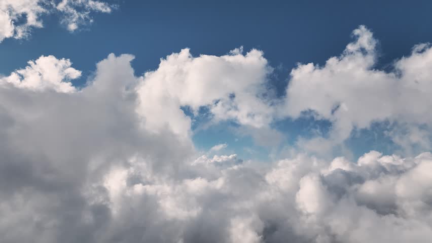 Aerial view Flying through beautiful thick fluffy clouds. Amazing timelapse of flowing soft white clouds moving slowly across a clear blue sky in clear daylight. Royalty-Free Stock Footage #1098819553