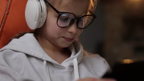 Premium Photo  Boy kid and headphones with tablet on bed for online games  watching movies or play educational app happy child digital technology or  listening to multimedia music or streaming cartoon