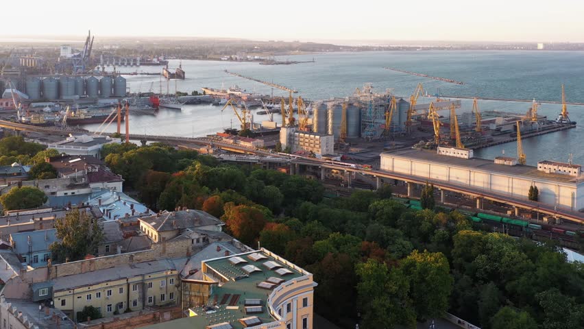 Aerial drone view of sea port with tower cranes. Ukraine Odessa cityscape.