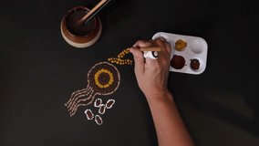 Dot style painting female hand creating Australian themed artwork. Original artist design - Powered by Shutterstock - Get 15% off with code: PIKWIZARD15