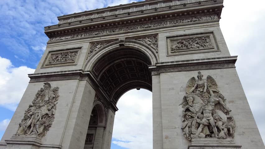 The Top Of The Arc De Triomphe On A Cloudy Blue Sky In Paris, France. Low Angle Royalty-Free Stock Footage #1098834439