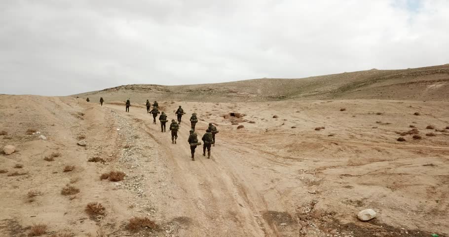 IDF Soldier from Israel Walking During Military Operation in Desert Royalty-Free Stock Footage #1098834759