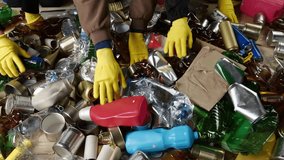 Sorting and Recycling Facility. Manual Seperation of recyclable plastic, aluminum, glass, paper, cartons, and cardboard - Powered by Shutterstock - Get 15% off with code: PIKWIZARD15