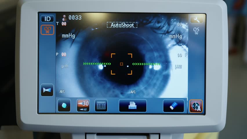 Optometrist examining patient's eyes in eye surgery clinic. Doctor checking eyesight. High quality 4k footage