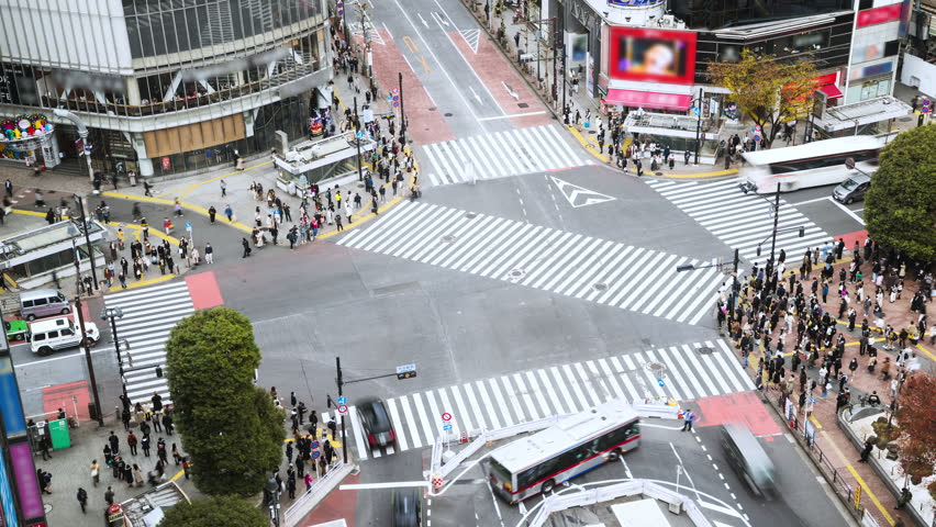 Time lapse of car traffic transportation, crowded people walk cross road at Shibuya scramble crossing. Tokyo tourist attraction landmark, Japan tourism, Asia transport or Asian city life concept Royalty-Free Stock Footage #1098857819