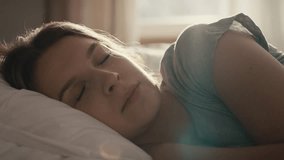 Caucasian woman waking up in sunny day. Shot with RED helium camera in 8K. 