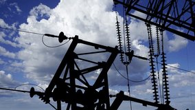 Electricity pylon (high voltage power line), black contour, on the background of the cloudy sky (time lapse) - Powered by Shutterstock - Get 15% off with code: PIKWIZARD15