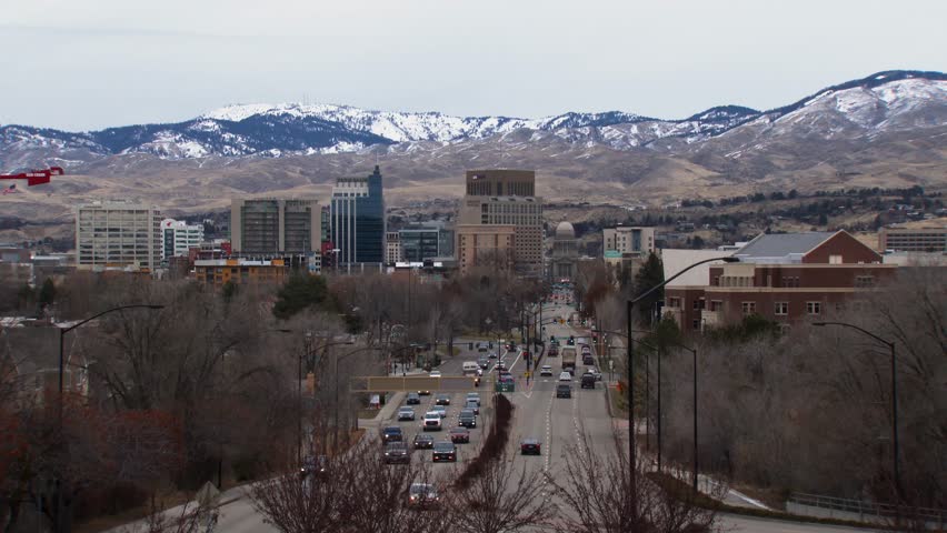 Wide view of the City of Boise looking down capitol street toward the Idaho State Capitol building with traffic.