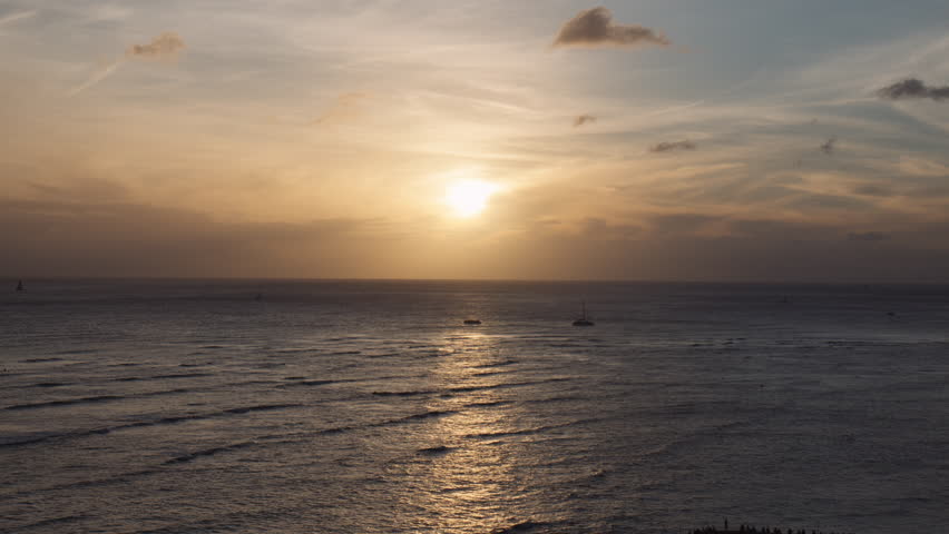 Sun Glitter Path Scattering Over Wind Waves of Waikiki Bay With Wispy Clouds in Background, Hawaii