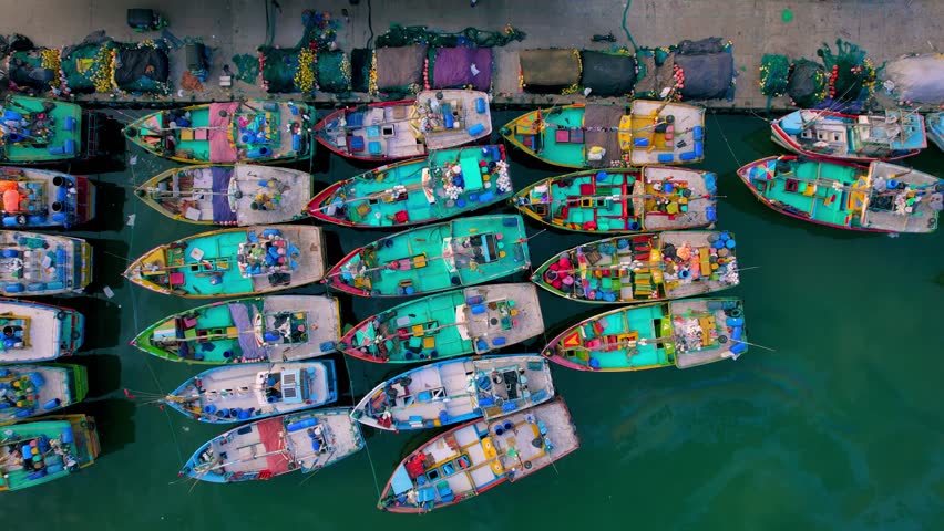 Fishermen's boats in the harbor of the port in Sri Lanka. The colorful of the boat. Traditional fishing boats in Sri Lanka. Tuna fishing in the Indian Ocean. High quality 4k footage Royalty-Free Stock Footage #1098868989