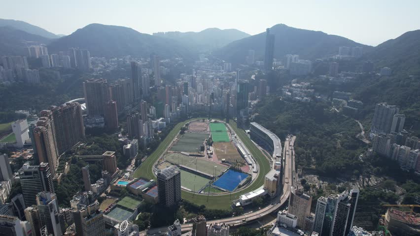 Aerial drone skyview of Hong Kong at Victoria Harbour Financial Central Admiralty Wan Chai Happy Valley Tai Hang Causeway Bay Kowloon District
