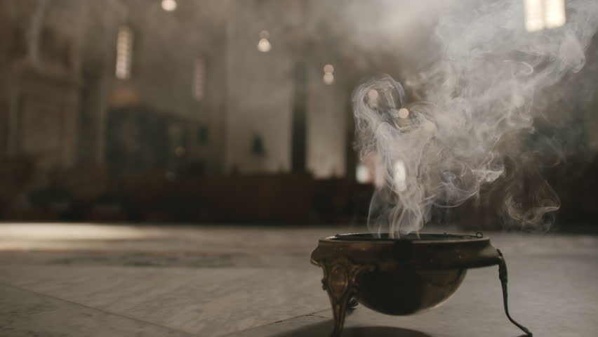 Footage of a bowl of incense on the floor of a church smoking in Bari, Italy. | Shutterstock HD Video #1098881009