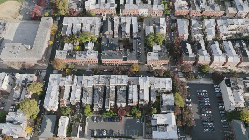 Aerial footage flyover of close housing and neighborhoods in north Philadelphia, Pennsylvania.