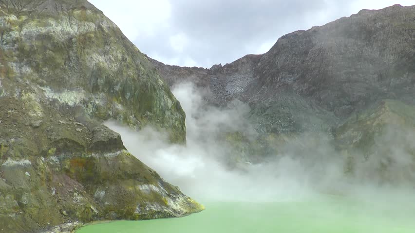 New Zealand. White Island volcanic crater with sulfur color, active geothermal land. Active volcano with steam rising from sulfur vents. Dangerous eruption.