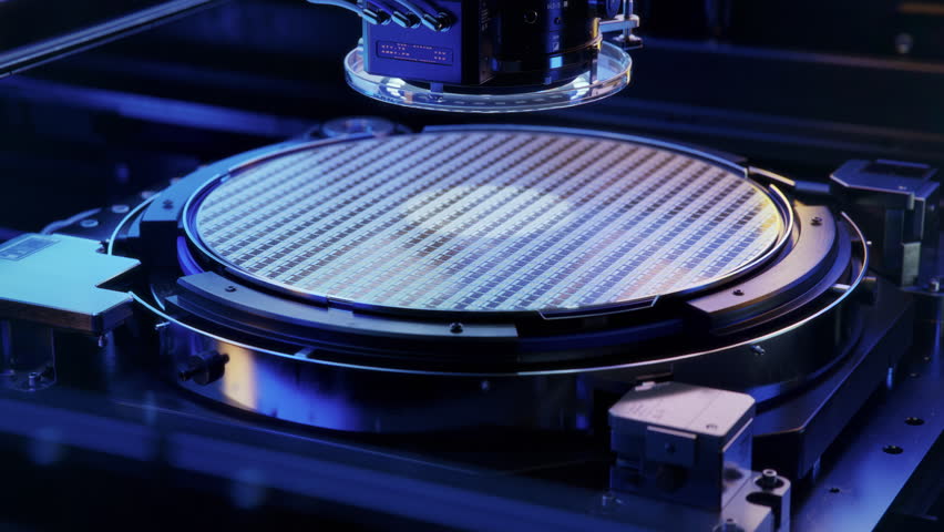 Silicon Wafer during Photolithography Process. Shot of Lithography Process that Creates Complex Patterns on Wafer during Semiconductor and Computer Chip Manufacturing and Production at Fab or Foundry. Royalty-Free Stock Footage #1098889397