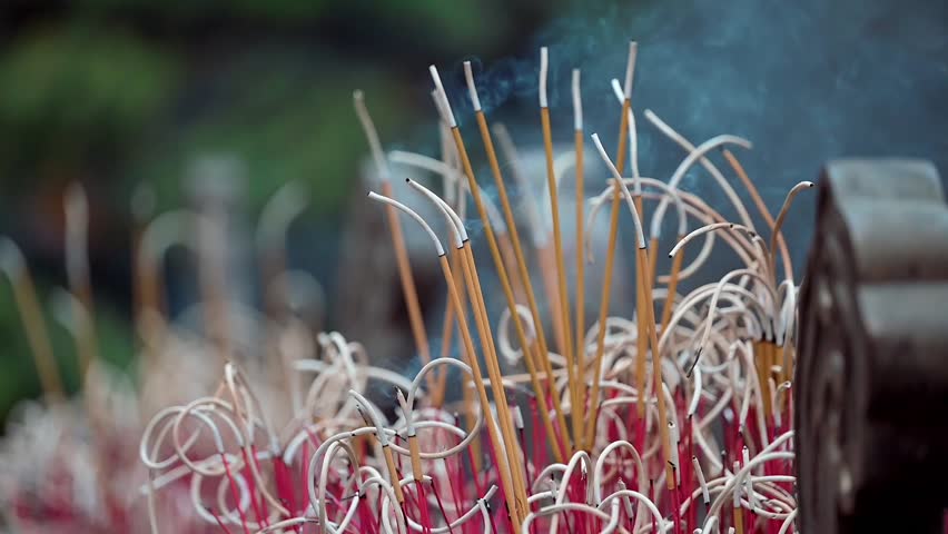 A closeup footage of incense burning at the Buddhist Chua Quan Su Temple in Hanoi, Vietnam