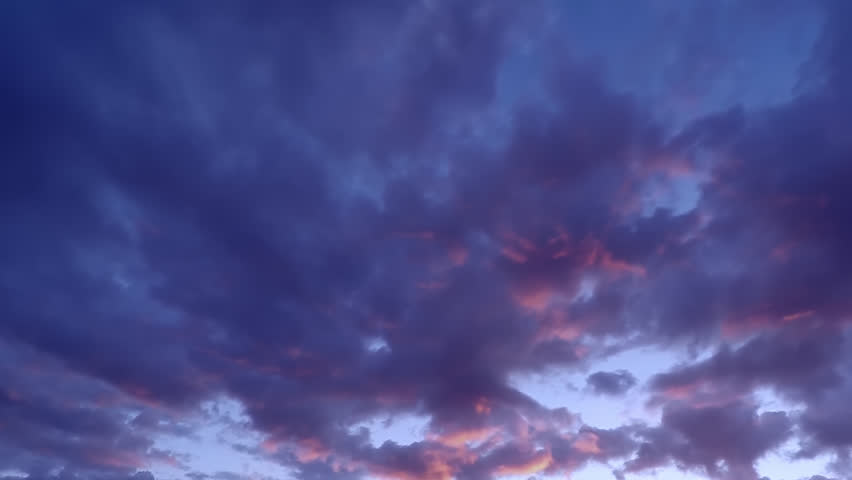 Timelapse of beautiful sunset sky turning to blue evening sky, cloudscape footage, clouds time lapse, beautiful cloudy motion.