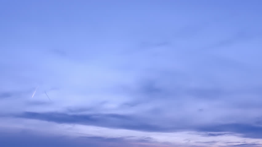 Timelapse of beautiful sunset sky turning to blue evening sky, cloudscape footage, clouds time lapse, beautiful cloudy motion. Royalty-Free Stock Footage #1098895353